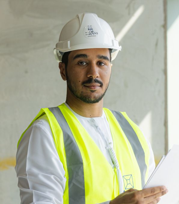 fit outs abu dhabi person waring personal protection equipment
